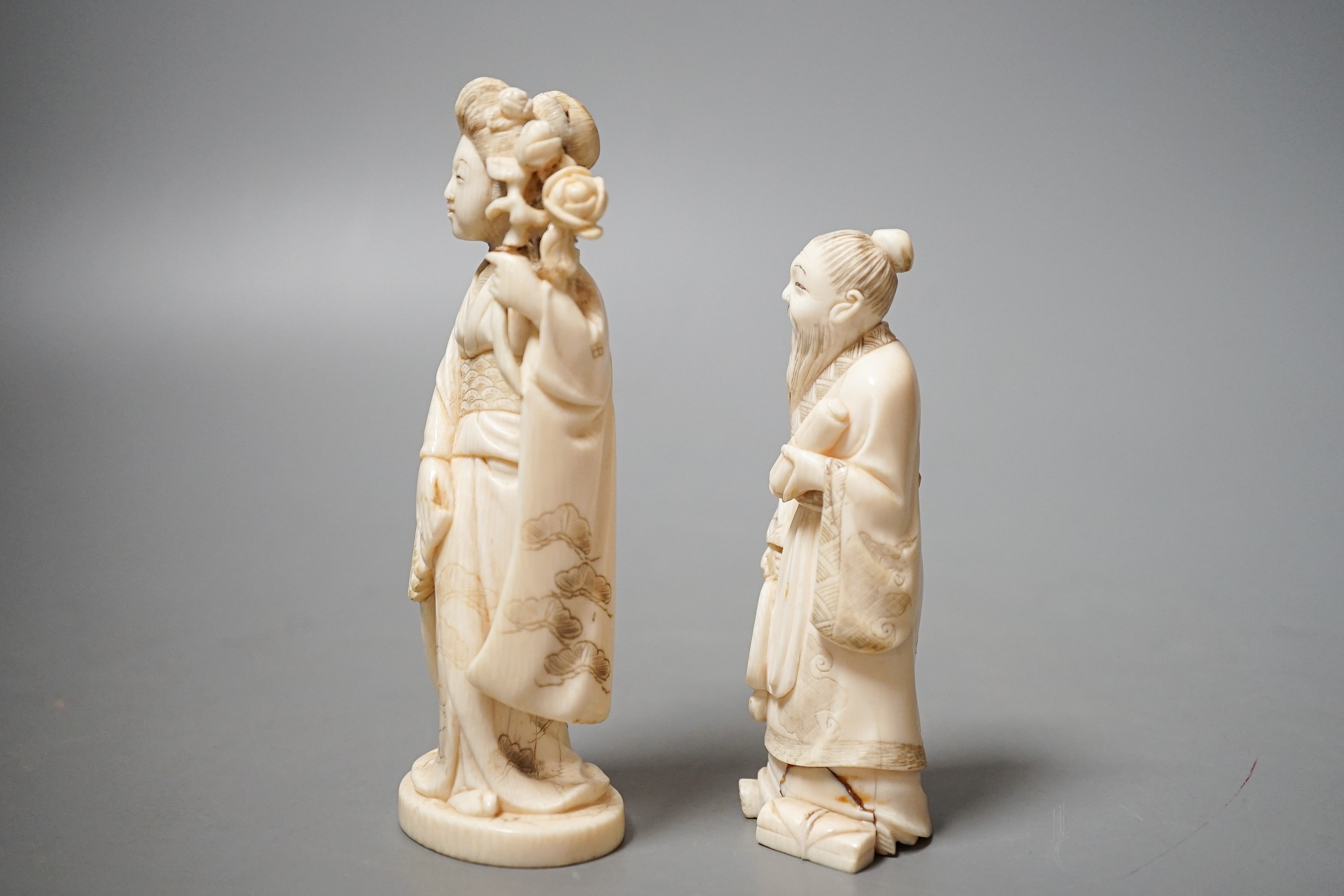Two Japanese ivory figures of a bijin and a sage, early 20th century 12cm